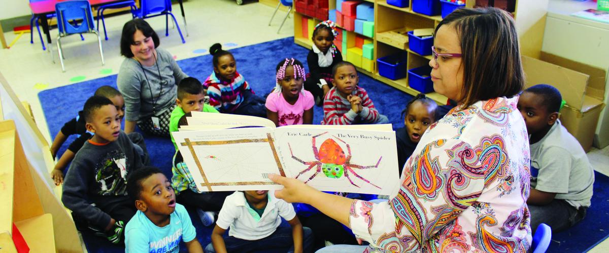 Teacher reading to classroom