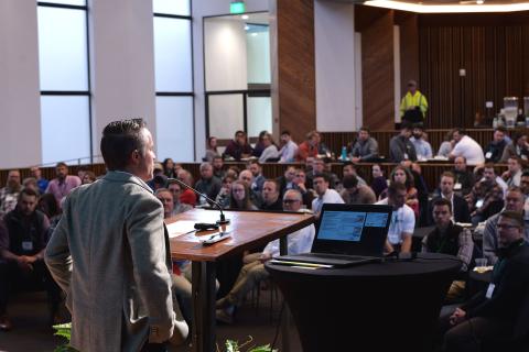 Keynote speaker Josh Roundy addresses audience at stormwater conference